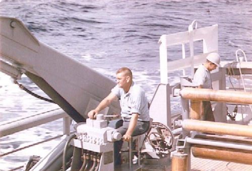 USS Venture MSO-496 Here is another unique installation.  Venture was the only MSO to have two one ton hydraulic cranes installed (in June, 1960) on the fantail for the streaming of minesweep gear.<br>BMC Smith at the controls. 