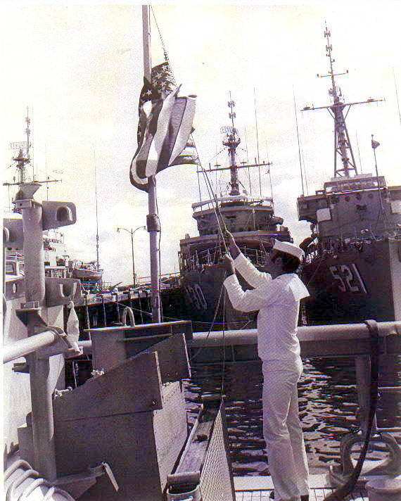 USS VENTURE MSO-496 ensign being hauled down for the last time, with USS DIRECT (MSO-430 and USS ASSURANCE (MSO-521) in the background. Courtesy of CDR Douglas Conwell USN (Ret)